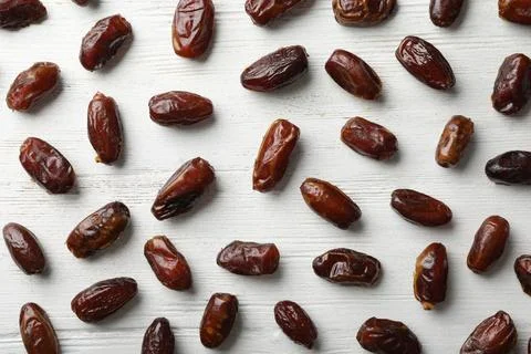Flat lay composition with dates on wooden background. Dried fruit as healthy  스톡 사진