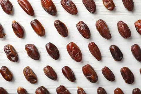 Flat lay composition with dates on wooden background. Dried fruit as healthy  스톡 사진