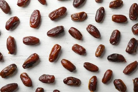 Flat lay composition with dates on wooden background. Dried fruit as healthy  스톡 사진