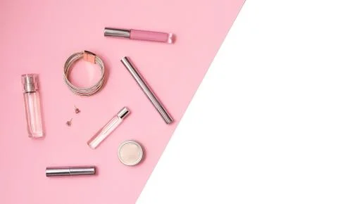 Flat lay composition with decorative makeup products, parfume and jewellery on Stock Photos