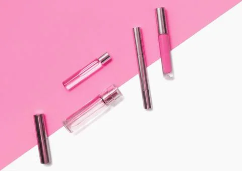 Flat lay composition with decorative makeup products and parfume on vivid pink Stock Photos