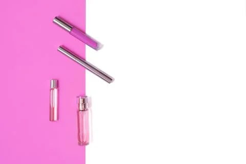 Flat lay composition with decorative makeup products and parfume on lilac and Stock Photos