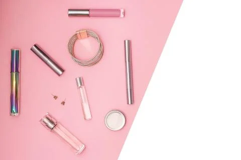 Flat lay composition with decorative makeup products, parfume and jewellery on Stock Photos