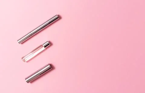 Flat lay composition with decorative makeup products and parfume on pink Stock Photos