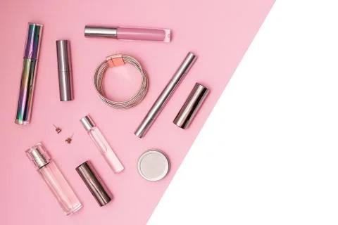 Flat lay composition with decorative makeup products, parfume and jewellery on Stock Photos