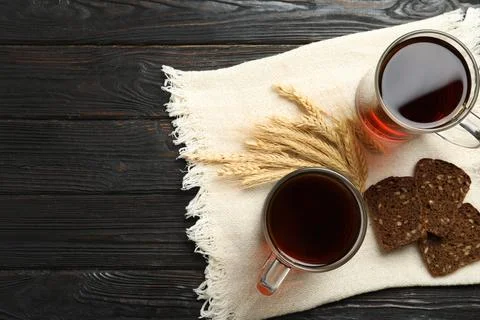 Flat lay composition with delicious kvass, spikes and bread on wooden table,  Stock Photos