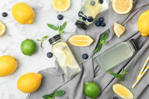 Flat lay composition with delicious natural lemonade on marble background Stock Photos