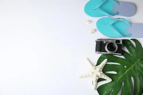 Flat lay composition with different beach objects on white background, space  Fotos de archivo