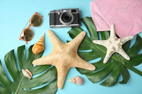 Flat lay composition with different beach objects on color background Fotos de archivo