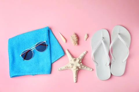 Flat lay composition with different beach objects on color background Stock Photos