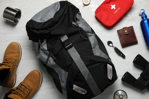 Flat lay composition with different camping equipment on light background Stock Photos