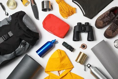Flat lay composition with different camping equipment on white background Stock Photos