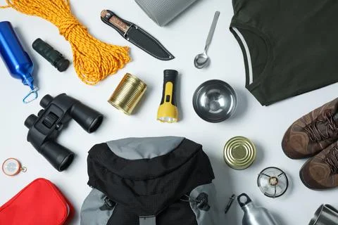 Flat lay composition with different camping equipment on white background Stock Photos