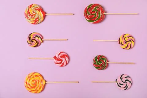 Flat lay composition with different candies on color background Stock-Fotos