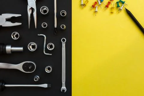 Flat Lay Composition With Different Construction Tools on Black and Yellow Stock Photos