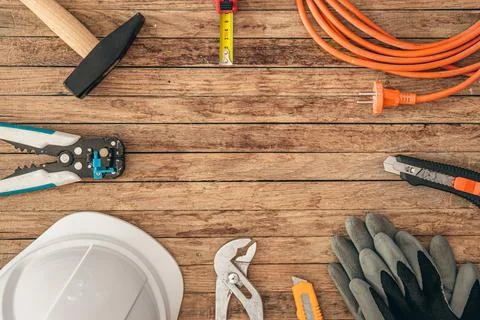 Flat lay composition with different construction tools on wooden background. Stock Photos