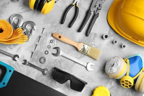 Flat lay composition with different construction tools on grey background 스톡 사진