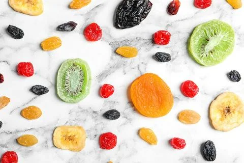 Flat lay composition with different dried fruits on marble background. Health Stock Photos