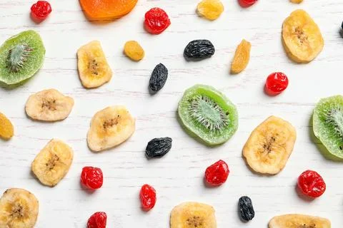 Flat lay composition with different dried fruits on wooden background. Health Stock Photos