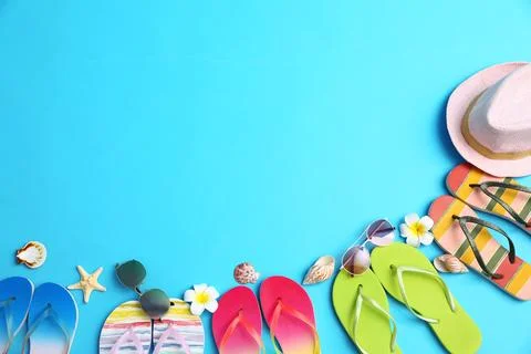 Flat lay composition with different flip flops on blue background, space for  스톡 사진