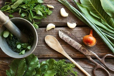 Flat lay composition with different herbs, rusty scissors and spoon on wooden Stock Photos