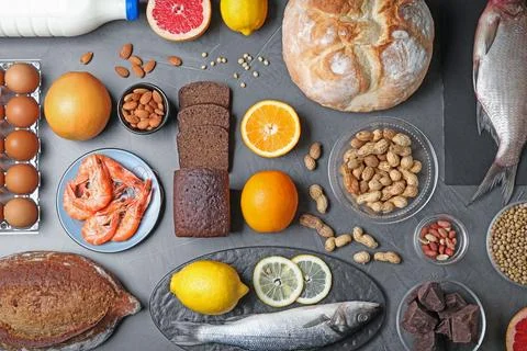 Flat lay composition with different products on dark grey background. Food al 스톡 사진