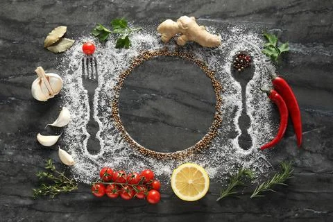 Flat lay composition with different spices, silhouettes of cutlery and plat.. Fotos de archivo