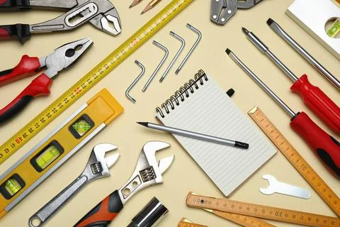 Flat lay composition with different tools on beige background Stock Photos