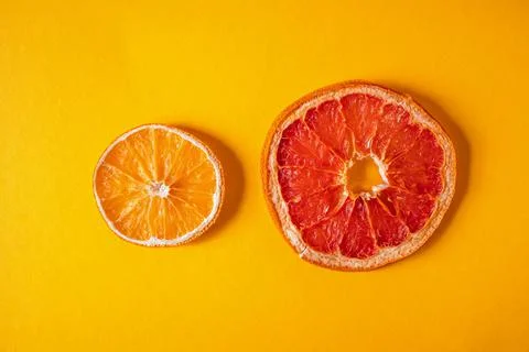 Flat lay composition with dry orange and dry grapefruit Stock Photos