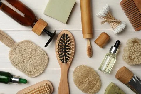 Flat lay composition with eco friendly products on white wooden background. C Stock Photos