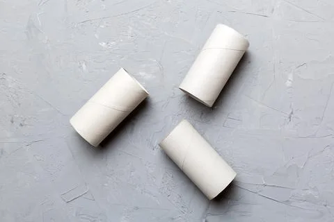 Flat lay composition with empty toilet paper rolls and space for text on colo Stock Photos