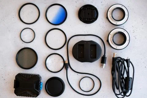 Flat lay composition with equipment for professional photographer on grey bac Stock Photos