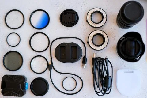 Flat lay composition with equipment for professional photographer on grey bac Stock Photos