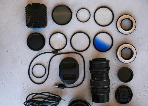 Flat lay composition with equipment for professional photographer on grey bac Stock Photos