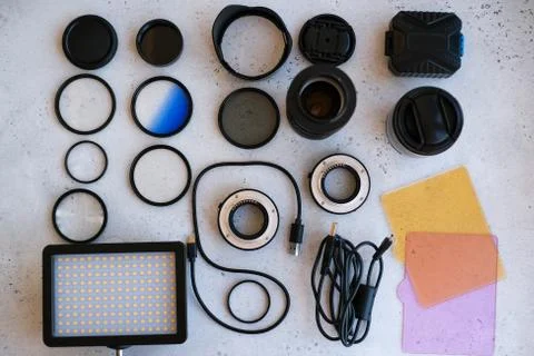 Flat lay composition with equipment for professional photographer on grey bac Stock Photos