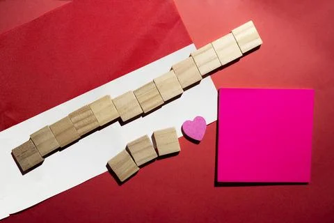 Flat lay composition featuring the red and white color with blank wooden cu.. Stock Photos