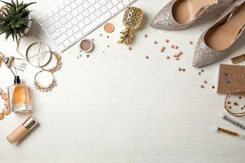 Flat lay composition with female accessories and computer keyboard on wooden  Stock Photos