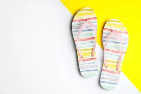 Flat lay composition with flip flops on color background, space for text. Bea Stock-Fotos
