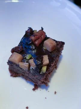 Flat lay composition with fresh brownies on parchment paper. Delicious chocol Stock Photos