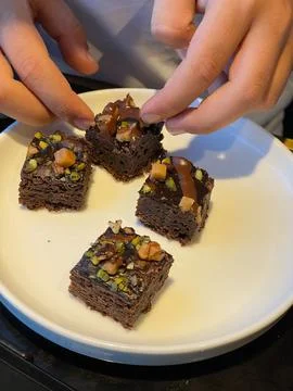 Flat lay composition with fresh brownies on parchment paper. Delicious chocol Stock Photos