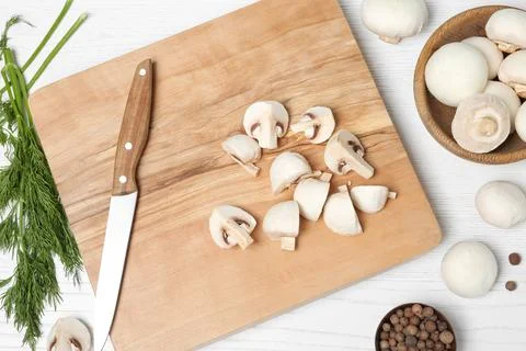 Flat lay composition with fresh champignon mushrooms on wooden table Foto stock