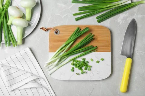 Flat lay composition with fresh green onion on marble background Stock Photos