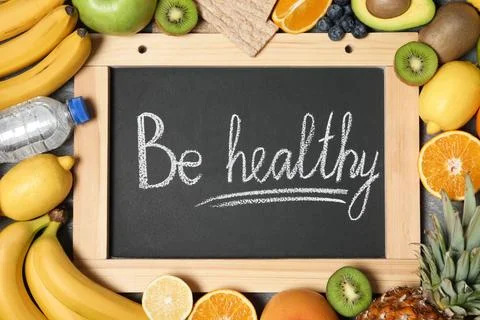 Flat lay composition with fruits and words "BE HEALTHY" on blackboard. Concep 스톡 사진