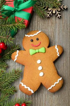Flat lay composition with gingerbread man on wooden table Stock Photos