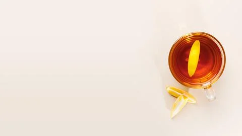 Flat lay composition with glass cup of black tea with lemon slice. Mug of tea Stock Photos