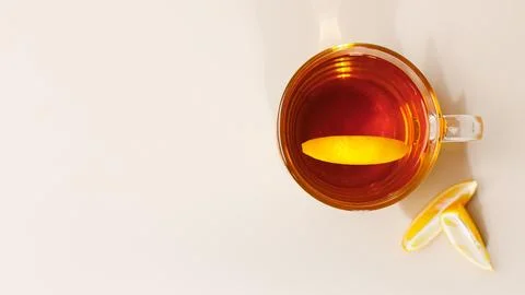 Flat lay composition with glass cup of black tea with lemon slice. Mug of tea Stock Photos