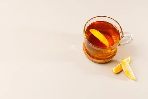 Flat lay composition with glass cup of black tea with lemon slice. Mug of tea Stock Photos