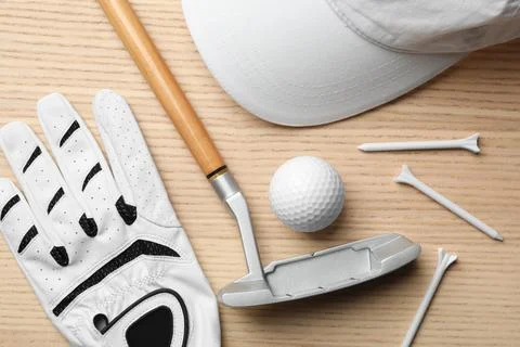 Flat lay composition with golf accessories on wooden background Stock Photos