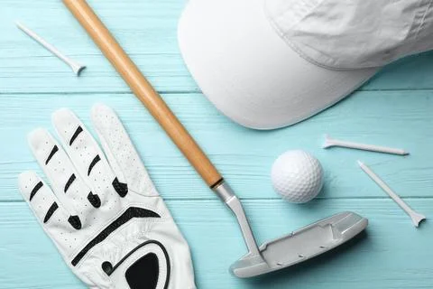 Flat lay composition with golf accessories on blue wooden background Stock Photos