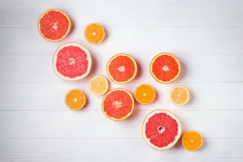 Flat lay composition with halves of different citrus fruits Stock Photos